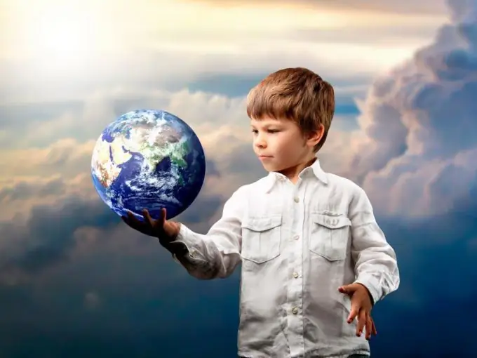 Boy holding the earth